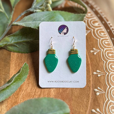 Handmade Christmas earrings featuring green light bulb design with gold accents, perfect for festive celebrations.