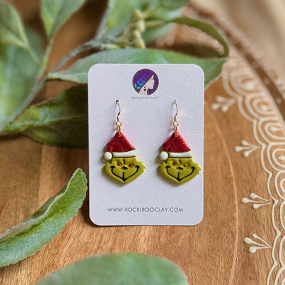 Handmade Christmas earrings featuring Grinch design with Santa hats, perfect for festive celebrations.