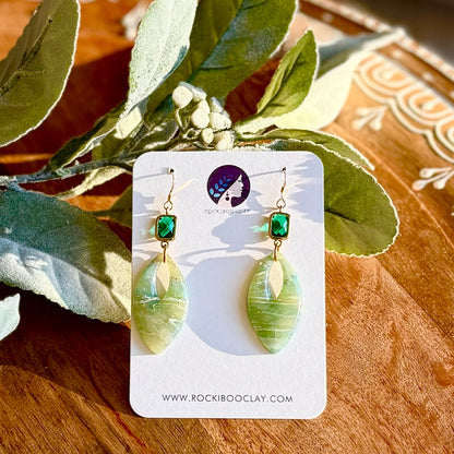 local handmade hypoallergenic polymer clay earrings with green leaf design and gold-filled settings.